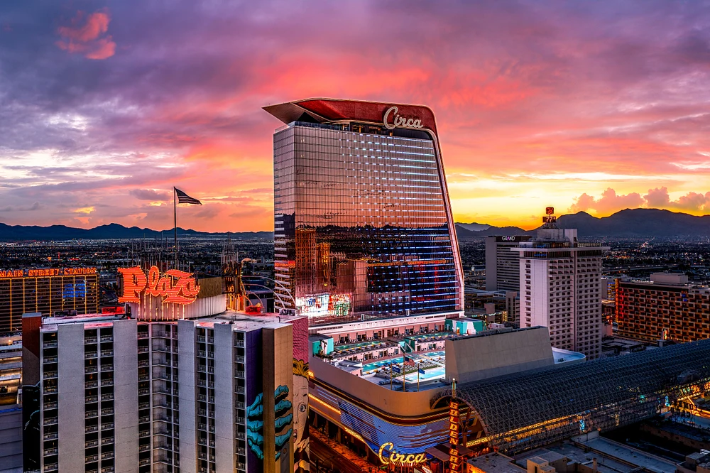 A stunning sunset view of the Las Vegas Strip, featuring the Circa Resort and Casino with colorful clouds in the background.