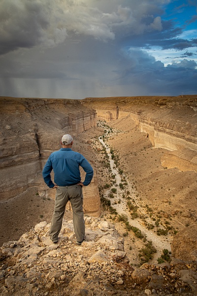 Man looking down at a Wadi in Yemen - Special: Namibia - Garth Fuchs Photography 