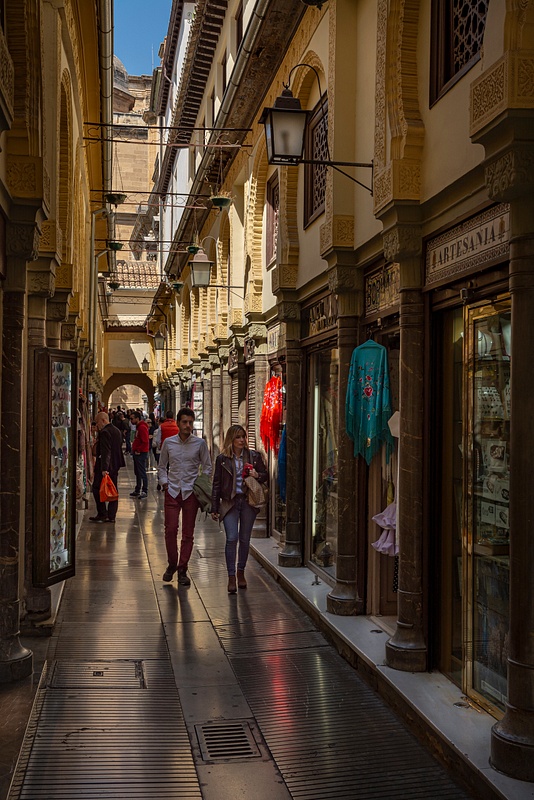 Narrow-shopping-arcade-Granada-Spain