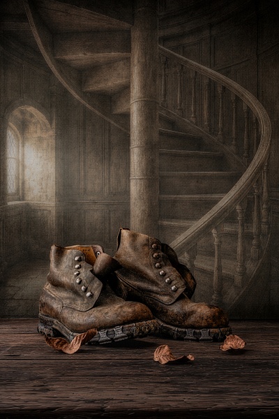 The Wayfarer by Marko Klavs, a fine art still life photograph of worn vintage leather boots resting at the foot of an old wooden staircase in a timeless historic interior, with fallen leaves and soft window light.