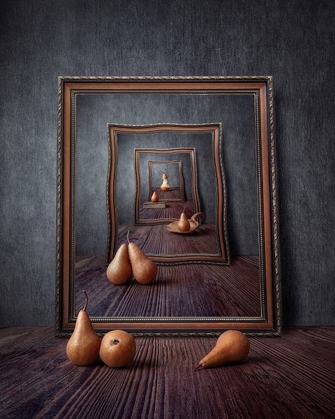 Infinite Pears by Marko Klavs, a fine art still life photograph of pears arranged within a sequence of antique frames that repeat into the distance, creating an illusion of infinite space.