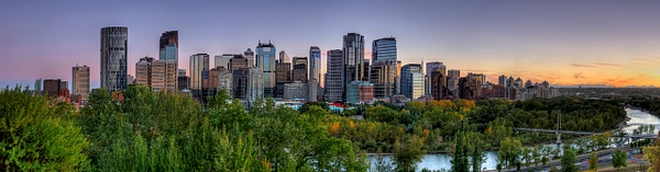 Panoramic view of Downtown Calgary - Summer with blue skies and orange horizon. - City of Calgary - Yves Gagnon Photography 