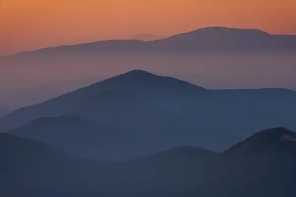 Layers of Mountain Tops under smoky morning, Canadian...
