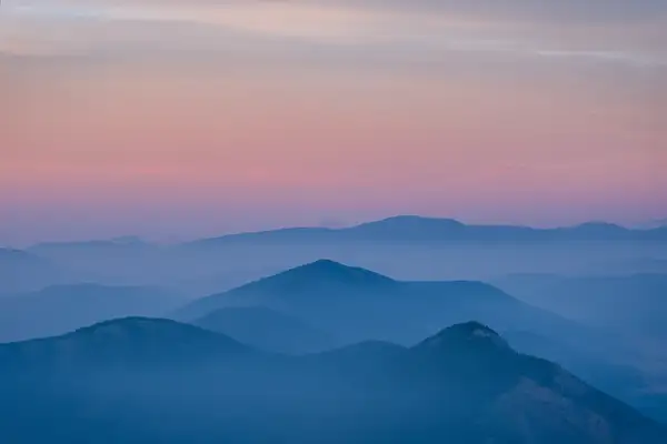 Layers of Mountains Covered of Smoke Forest Fire Sunrise...