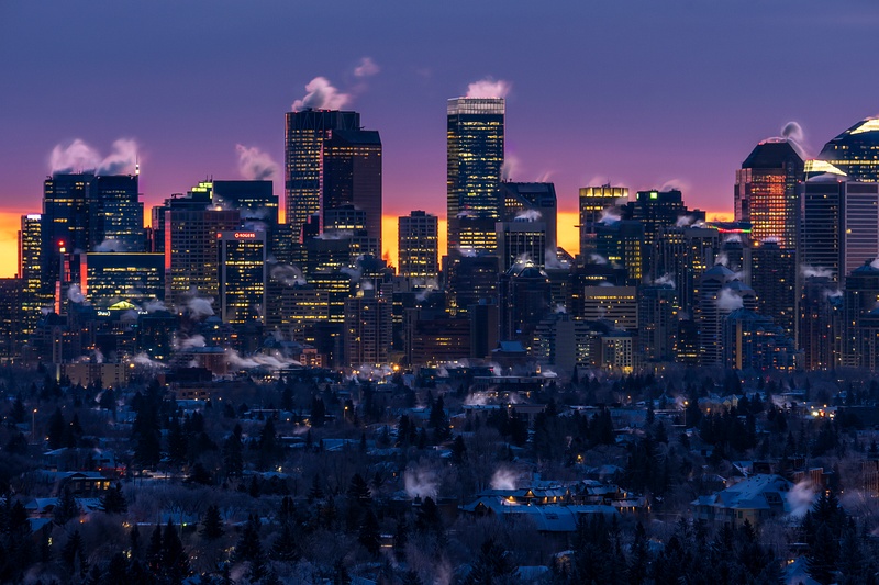 City of Calgary under Deep Freez with smoke Stacks Sunrise December 2021