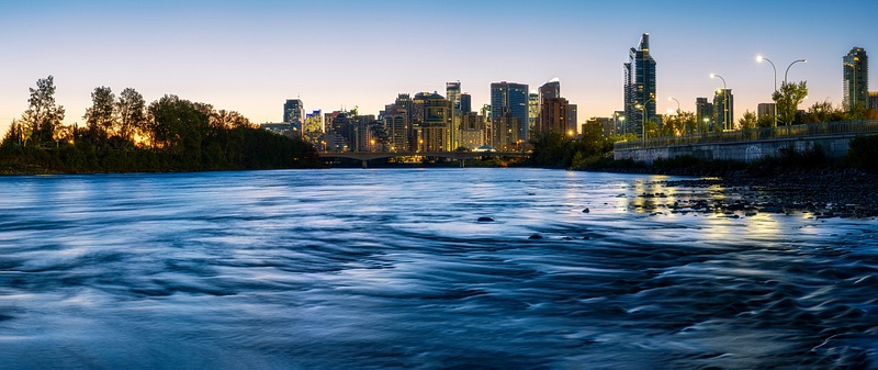 Panoramic view of the City of Calgary from the Bow River during Blue Hour Sunrise Fall Colors