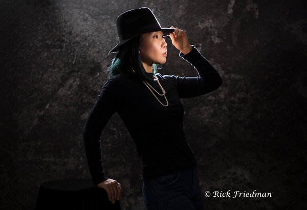 Model dressed in black wearing fedora by Rick  Friedman - Rick Friedman Photography 