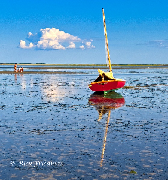 Red sailboat reflected in low tide in Provincetown, Cape Cod, MA by Rick Friedman - Rick Friedman Photography 