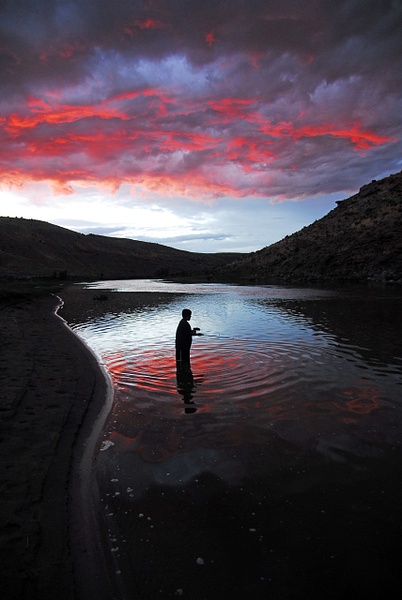 boy fishing in sunset - Wes Uncapher
