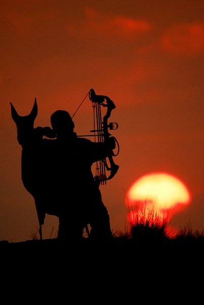 BOWHUNTER IN SUNSET - Wes Uncapher