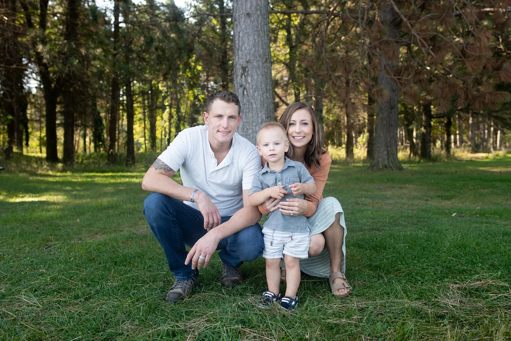 Family Portrait in a Serene Forest Setting