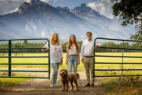 Family portrait with fence and labradoodle - Flo McCall Photography