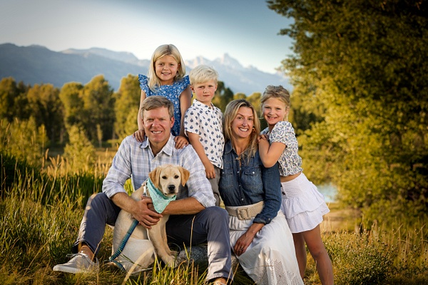 Family of 5 portrait with puppy and Tetons - Flo McCall Photography