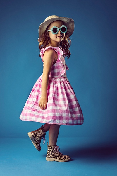 girl in studio in pink plaid dress - Flo McCall Photography 