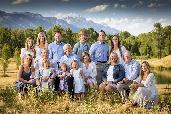 Extended family in blue with Tetons - Flo McCall Photography