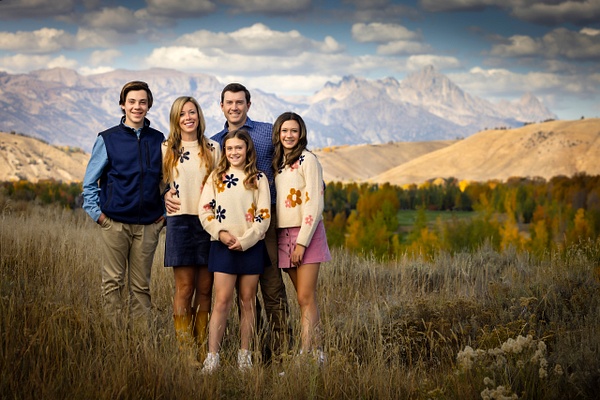 Fall portrait family standing with Mountain backdrop - Flo McCall Photography