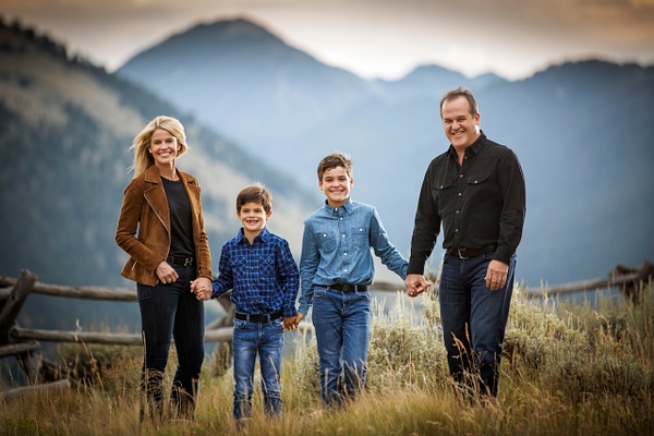 happy family holding hands in the mountains - Flo McCall Photography 