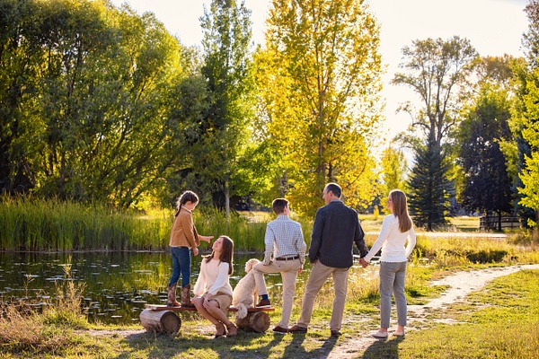 Backside family portrait with trees and pretty light - Flo McCall Photography