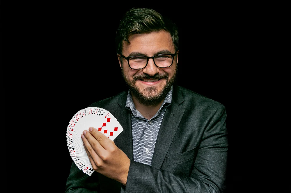 Professional Magician Performing Card Tricks