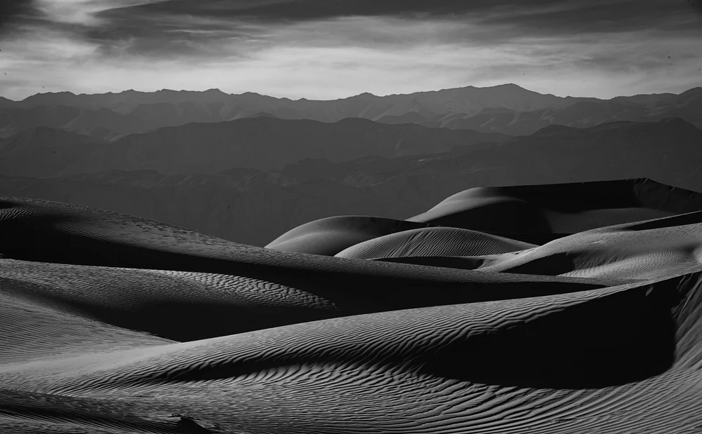 Sculpted Sand Dunes Under a Dramatic Sky