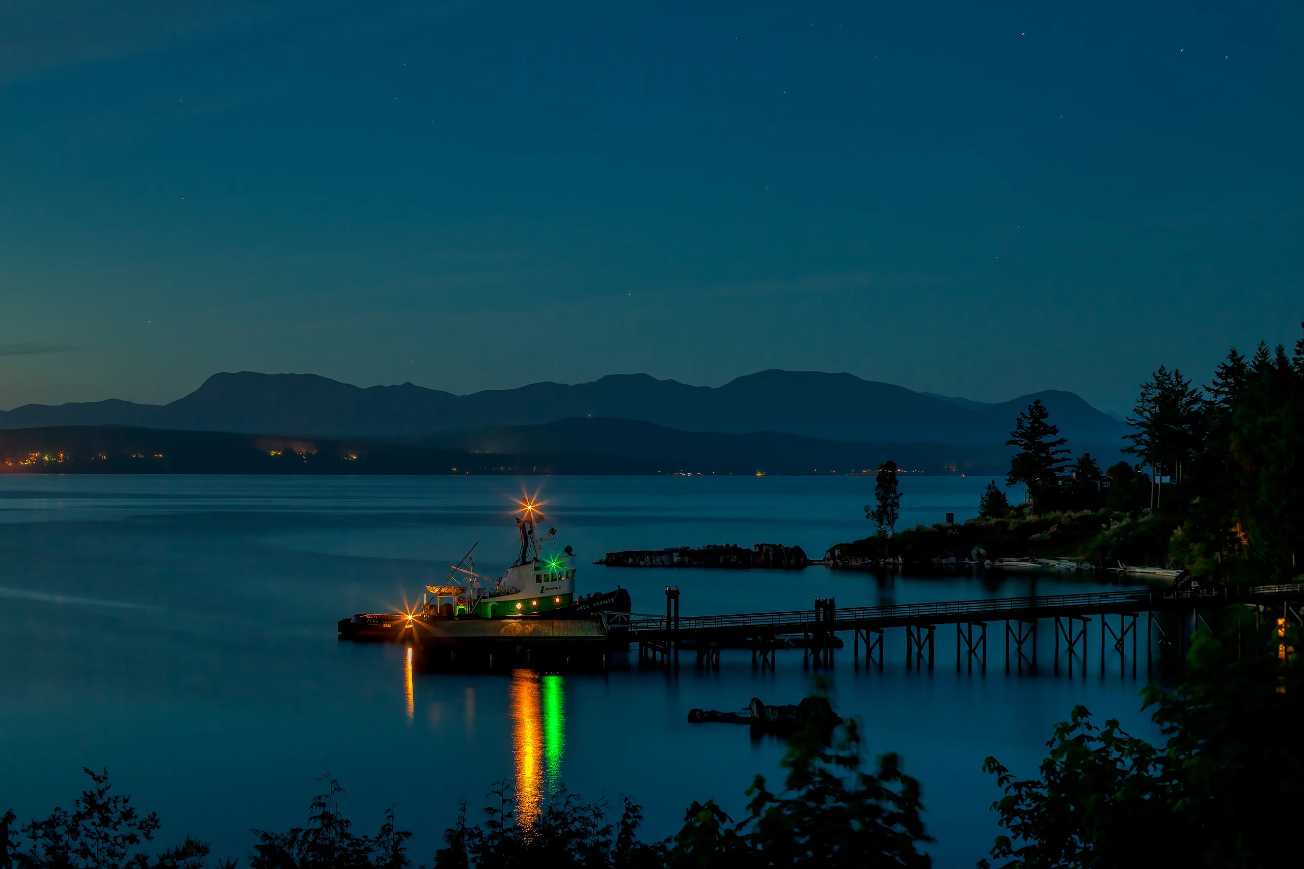 Captivating Blue Hour Scene with Tugboat Reflection
