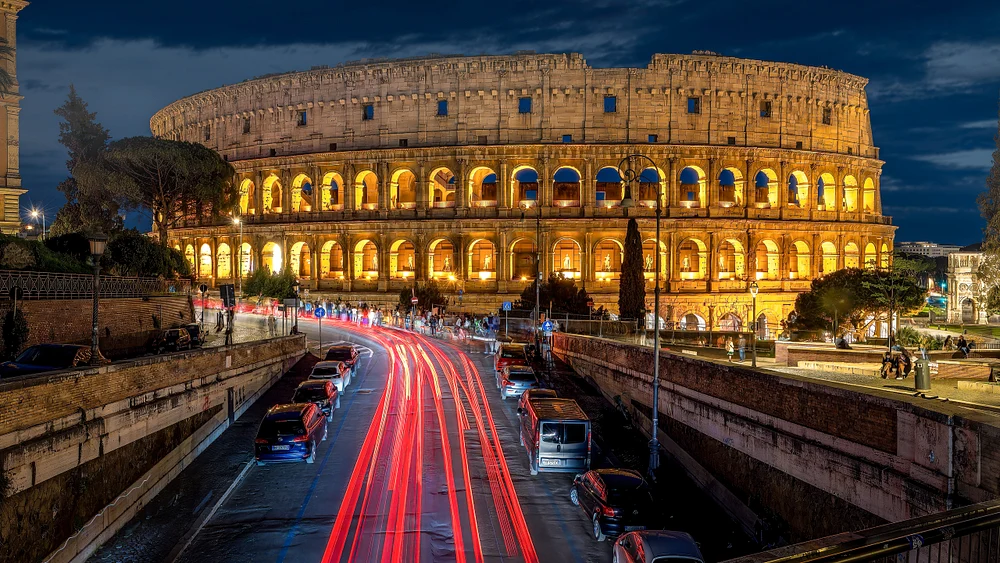 Illuminated Colosseum at Night with Light Trails, Rome Italy