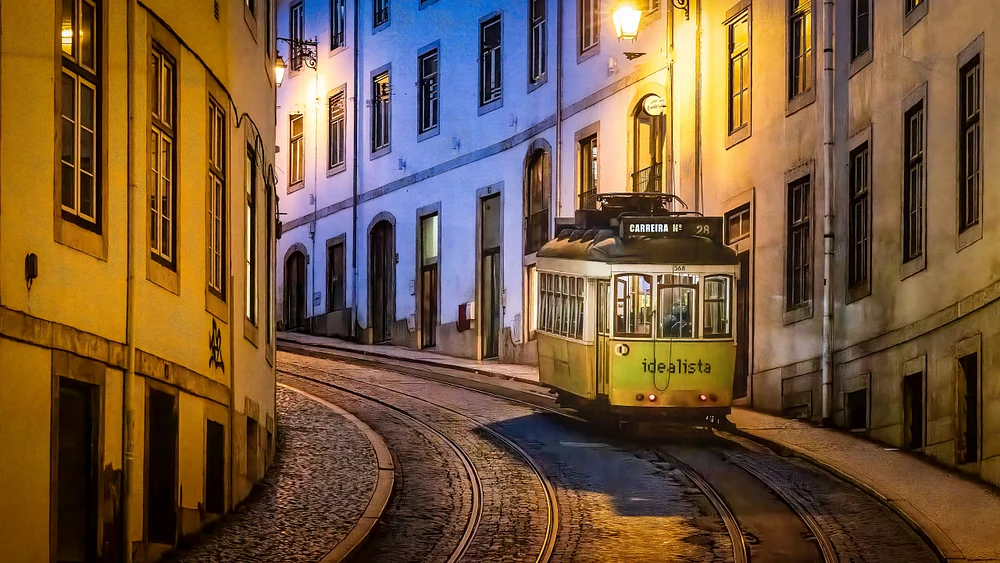 Historic Lisbon Tram 28 Navigating Cobblestone Streets at Twilight