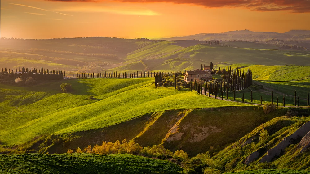 Golden Sunset Over Tuscan Villa with Cypress Trees and Rolling Hills