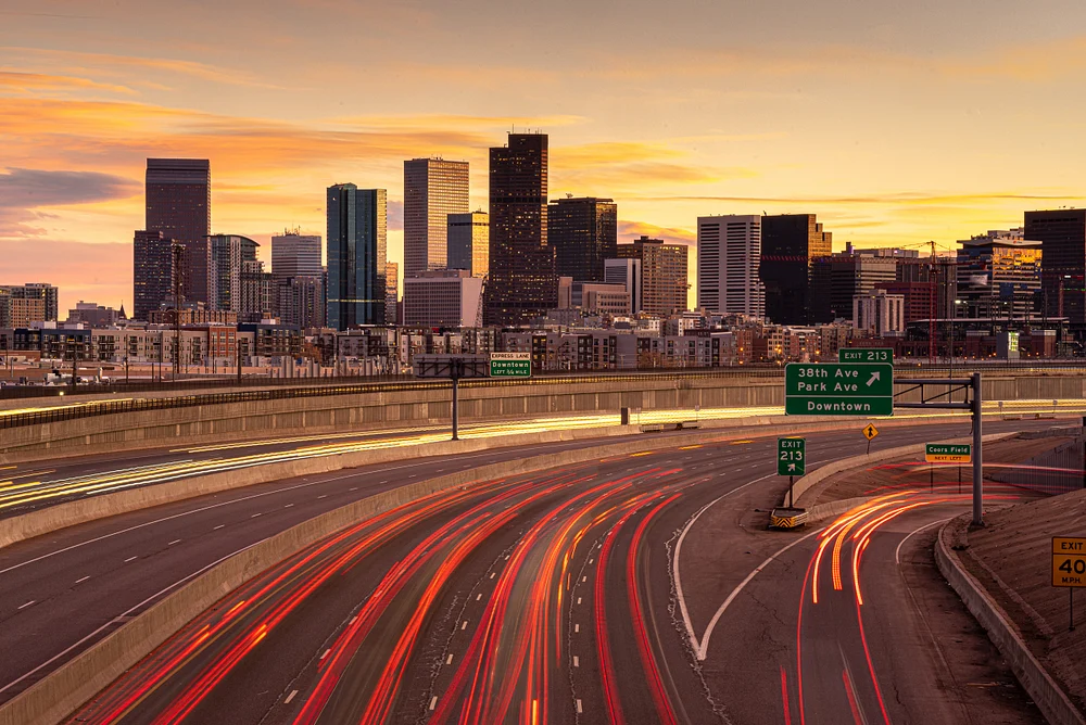 Denver Skyline at Sunset with Dynamic Highway Light Trails