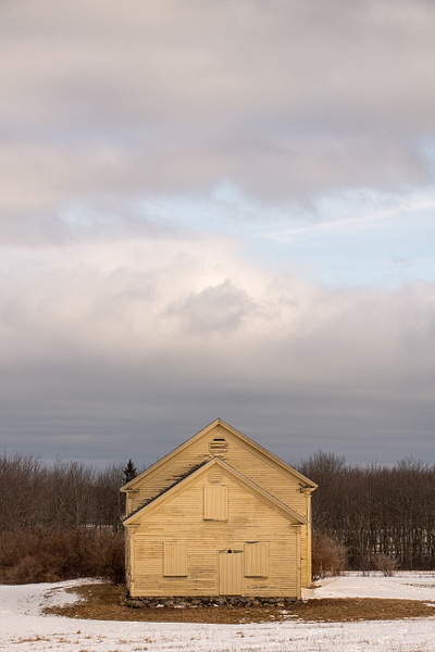 Touch of Blue Over Weathered Yellow Barn - Winter in New England - Jim Rothenberg