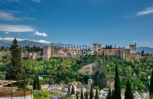 Alhambra-Palace-with-snow-capped-Sierra-Nevada-Mountains...