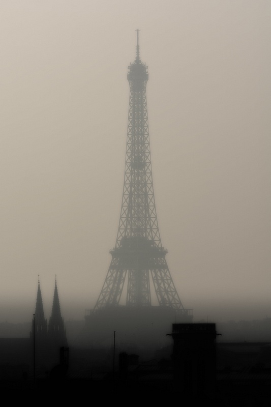 The Eiffel Tower by a foggy afternoon