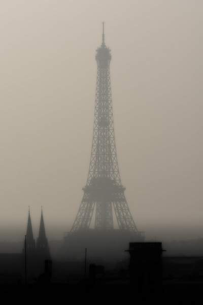 The Eiffel Tower by a foggy afternoon by Daniel...