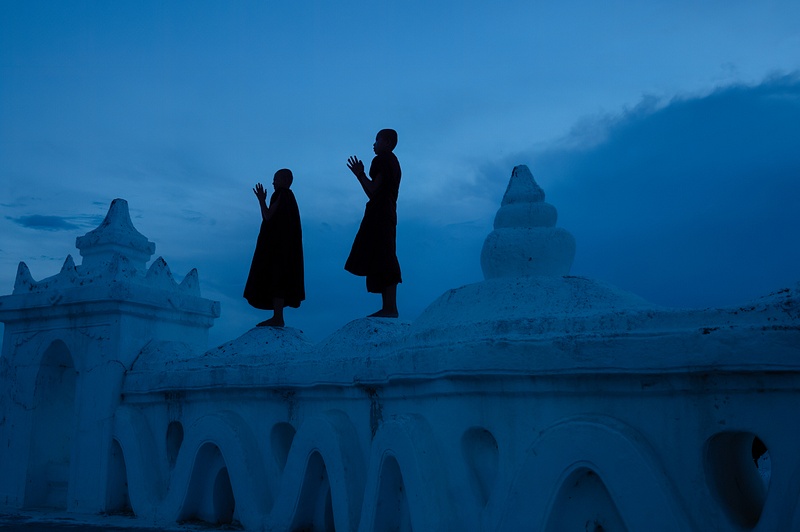 Blue hour silhouette of novice monks, Hsinbyume Pagoda, Myanmar