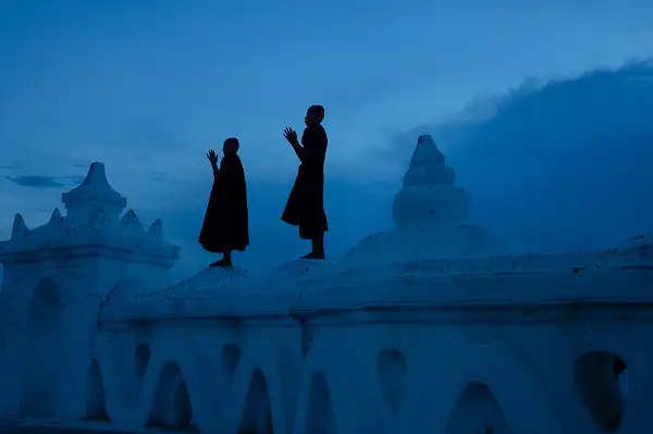 Blue hour silhouette of novice monks, Hsinbyume Pagoda,...