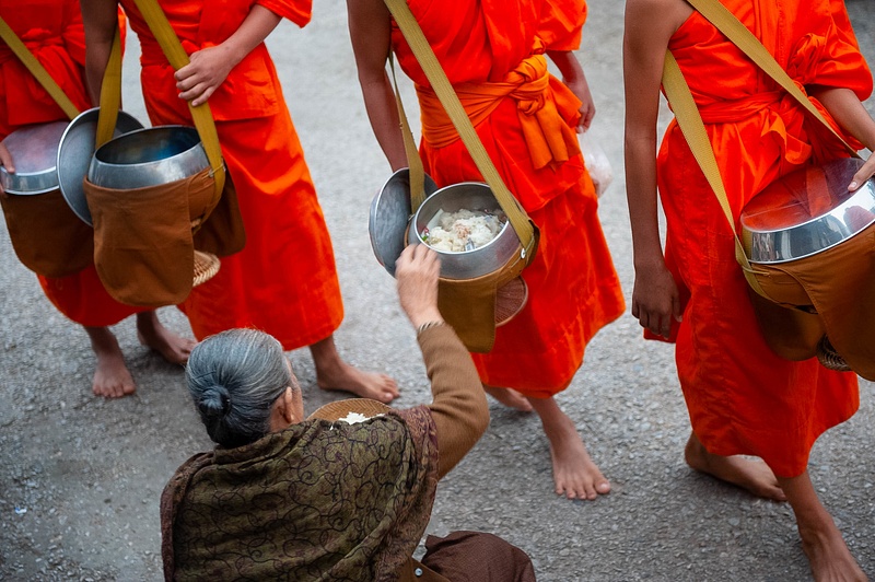 Monks receiving alms-giving (Tak Bat) ceremony, Luang Prabang, Laos