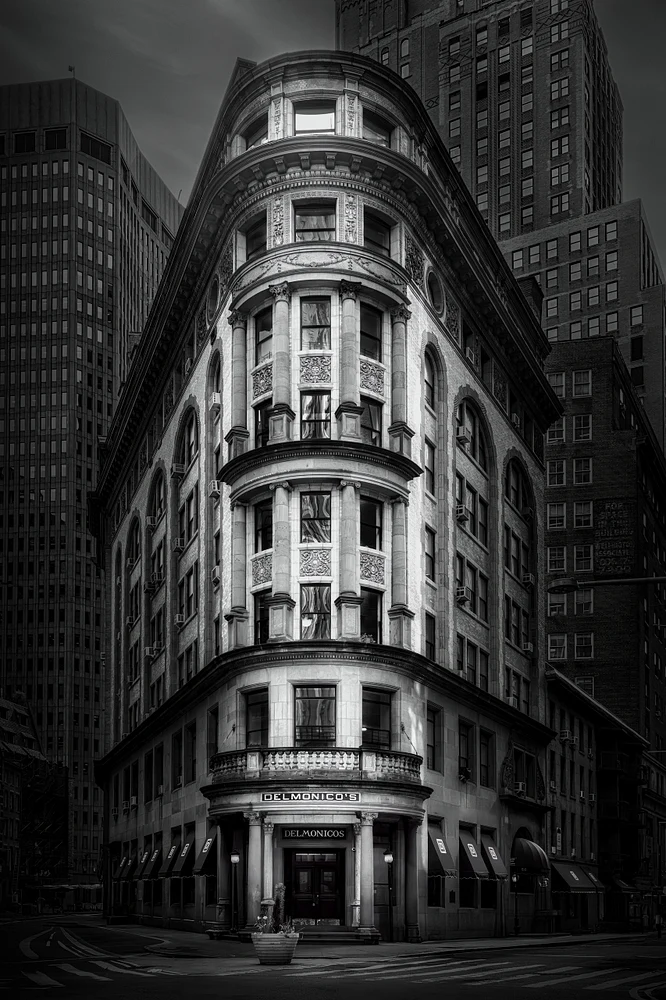 Black-and-white photo of a historic building in New York City showcasing elegant architectural details.