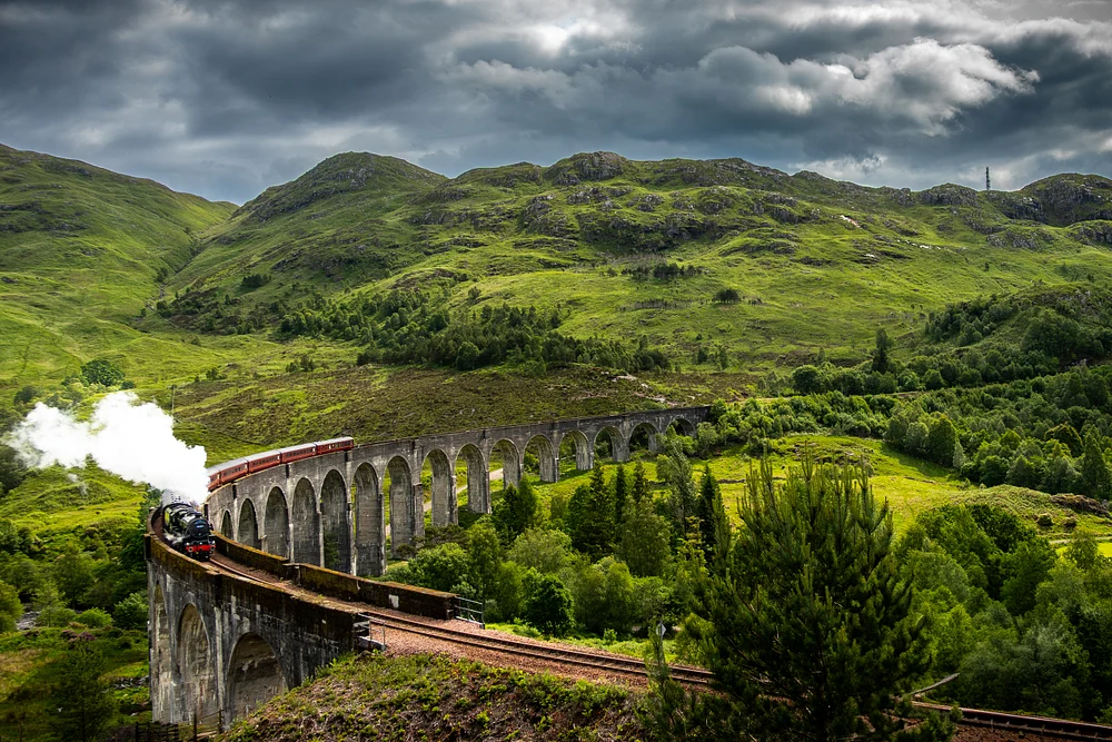 Majestic Steam Train Crossing the Glenfinnan Viaduct in Scotland