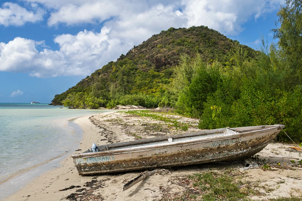 Abandoned Boat on Serene Shoreline