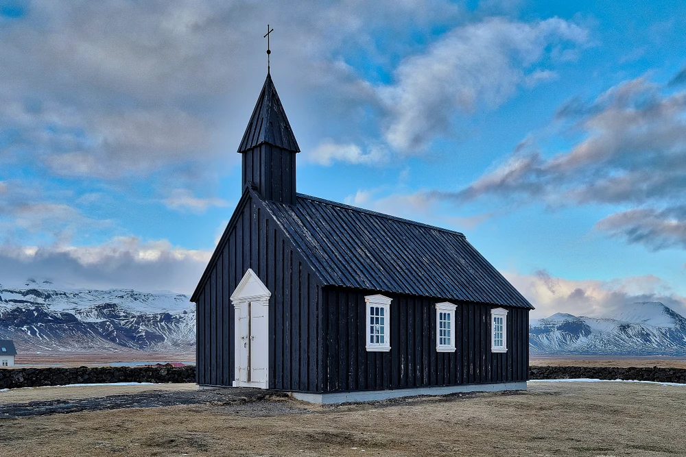 B&uacute;&eth;ir Black Church against a dramatic Icelandic sky on the Snaefellsnes Peninsula.
