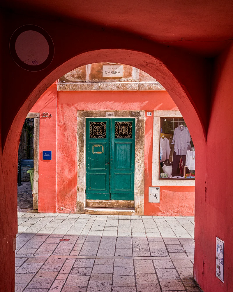 Charming Green Door Framed by Vibrant Archway
