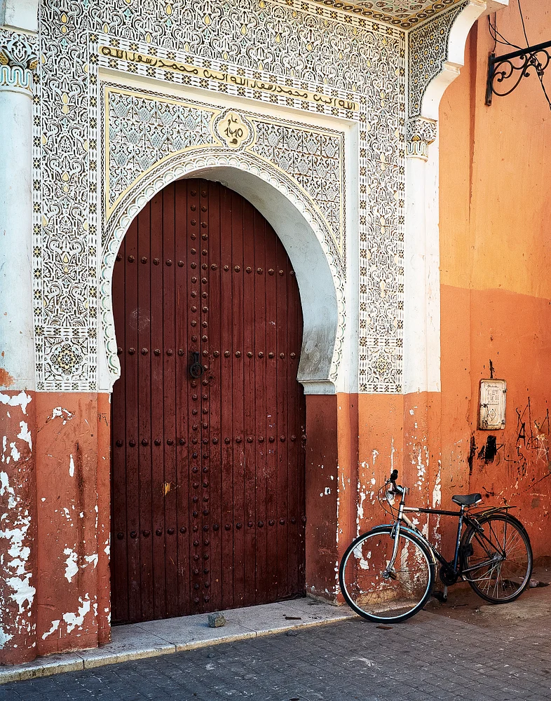 Intricate Moroccan Doorway with Vintage Bicycle