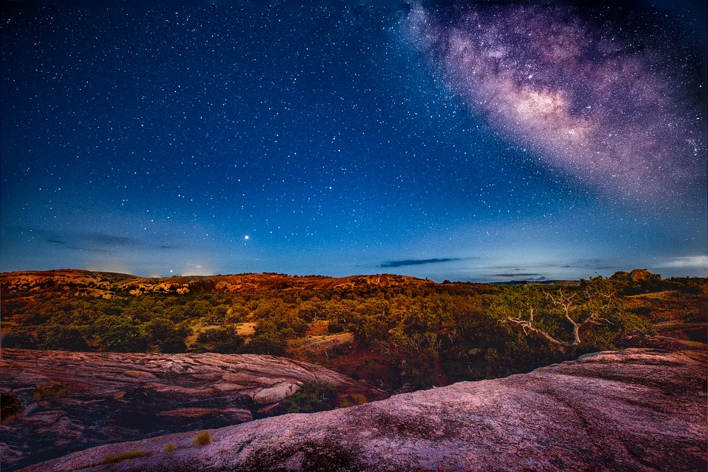 Stunning Nightscape with Milky Way Over Rugged Terrain