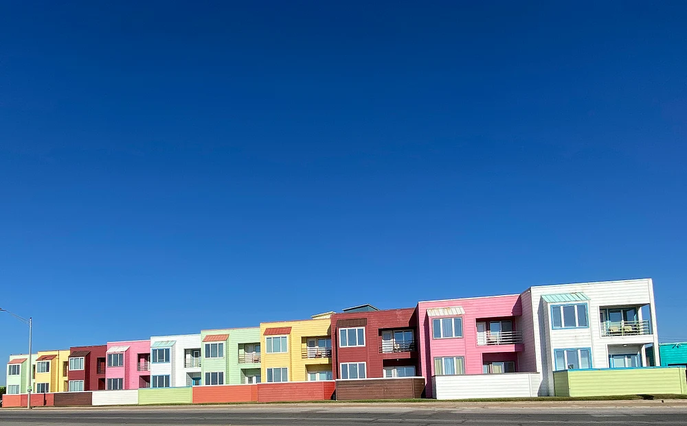 Vibrant Apartment Complex Under Clear Sky