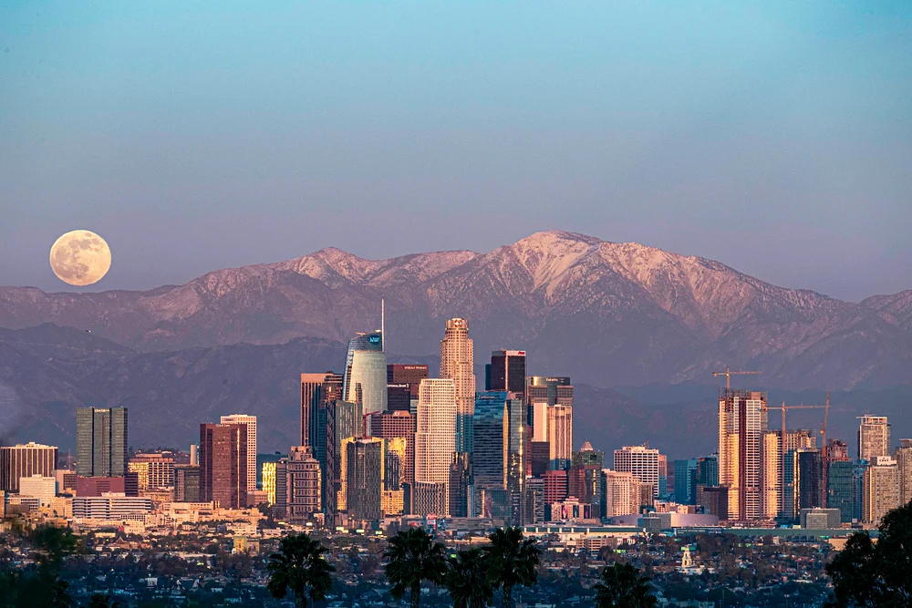 Stunning Los Angeles Skyline with Full Moon Over Mountains