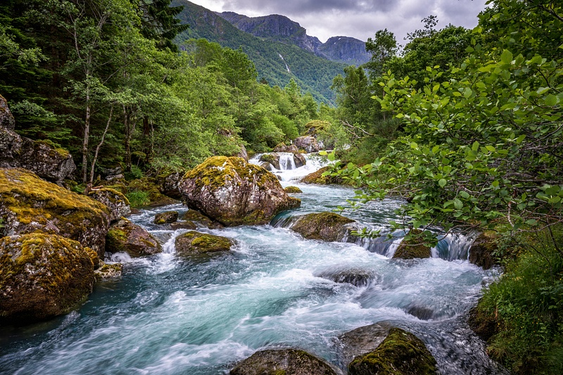 Emerald Torrent Beneath Norway’s Bondhusvatnet Peaks