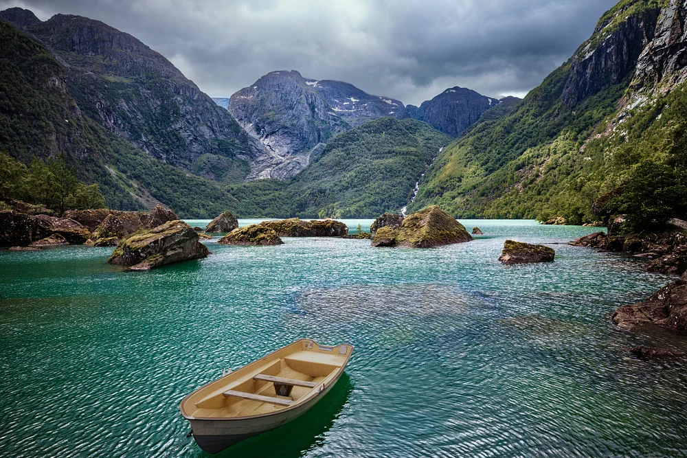 Rowboat Drifting Across Bondhusvatnet&rsquo;s Turquoise Fjord