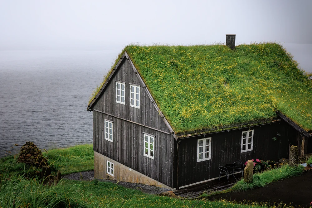 Hjallur Turf Cottage Above a Misty Faroe Inlet