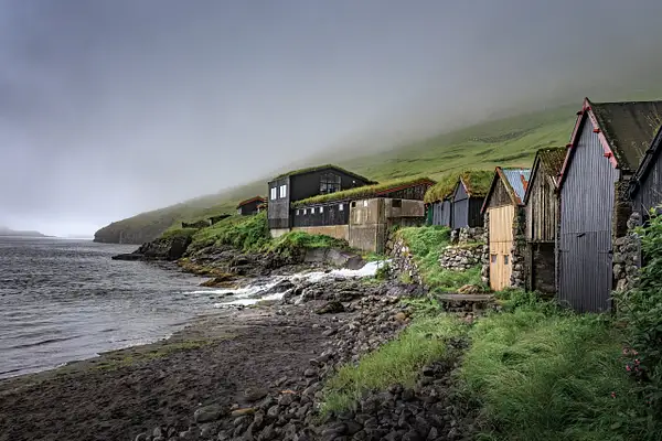 Fogbound Bour Boathouses Along a Faroe Island Shore by...