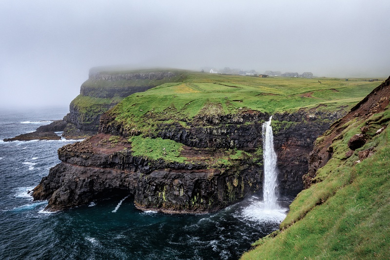 Múlafossur Plunge Beside Misty Vágar Cliffs